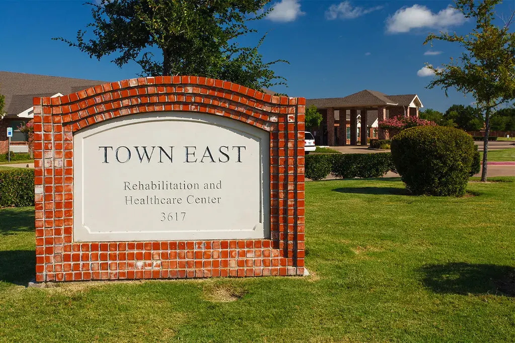 Brick sign welcoming visitors to Town East Rehabilitation and Care