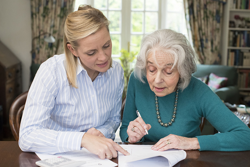 Mother and daughter reviewing care plan and options